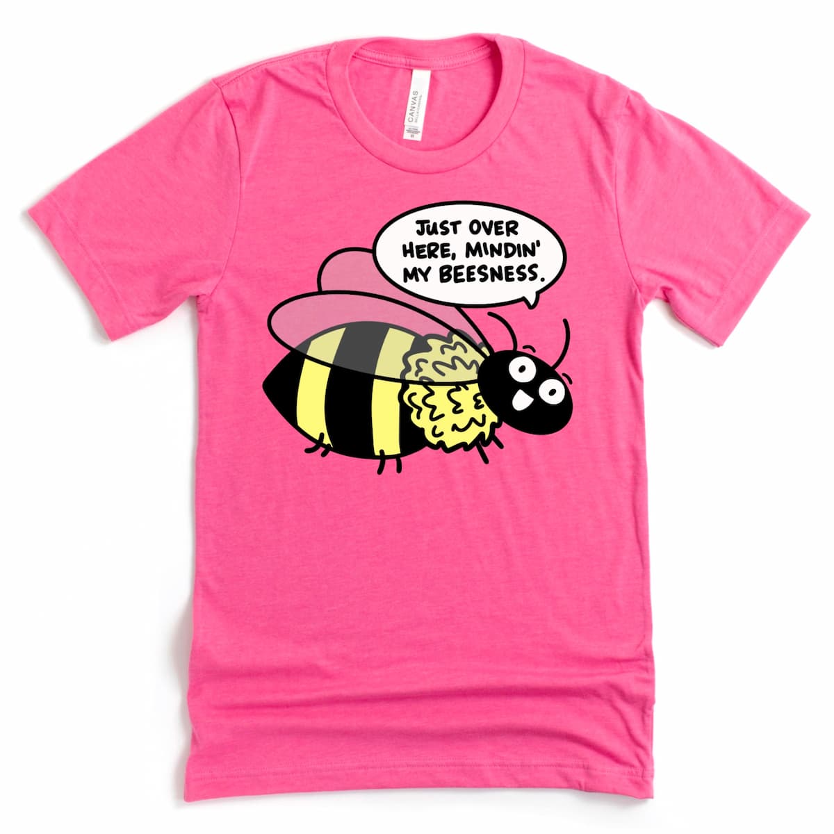 Heather charity pink t-shirt with cartoon bee and humorous pun “Just Over Here Minding My Beesness,” whimsical graphic tee by Kalirally
