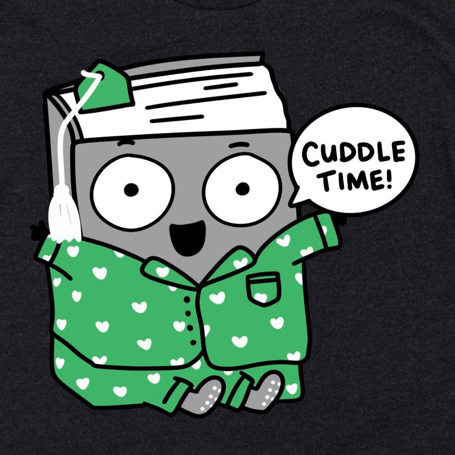 Close-up of Cozy Bookish Shirt in Heather Dark Grey showing cartoon book in patterned pajamas with “Cuddle time!” phrase, by Kalirally