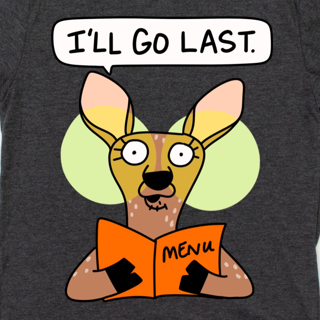Close-up of Funny Foodie Shirt design in Heather Dark Grey with cartoon deer clutching menu and “I’ll Go Last” phrase, by Kalirally