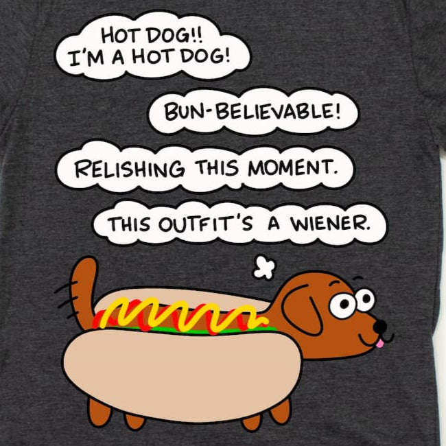 Close-up of Hot Dog Shirt in Heather Dark Grey showing dachshund cartoon dressed as hot dog with mustard and ketchup, by Kalirally