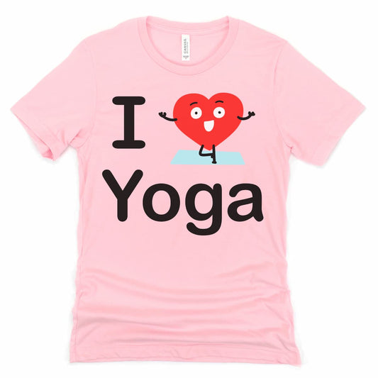 Flat lay of a pink I Heart Yoga tshirt featuring a playful cartoon heart doing a yoga tree pose.