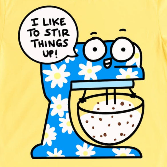 A close up image of a Funny baking shirt with cartoon standing mixer and “I like to stir things up!” phrase in Yellow by Kalirally
