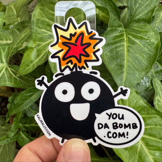 Cartoon compliment sticker with phrase “You da bomb dot com!” funny decal by Kalirally