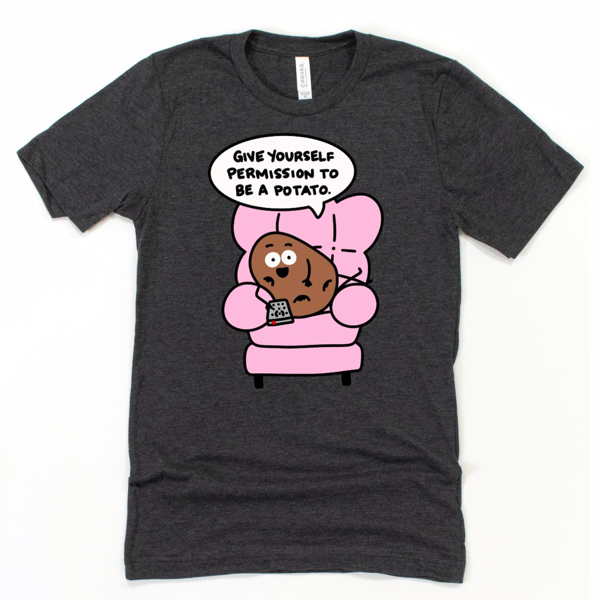 Funny Self Care Shirt in Heather Dark Grey with lounging cartoon potato and humorous “Be a potato” phrase, by Kalirally