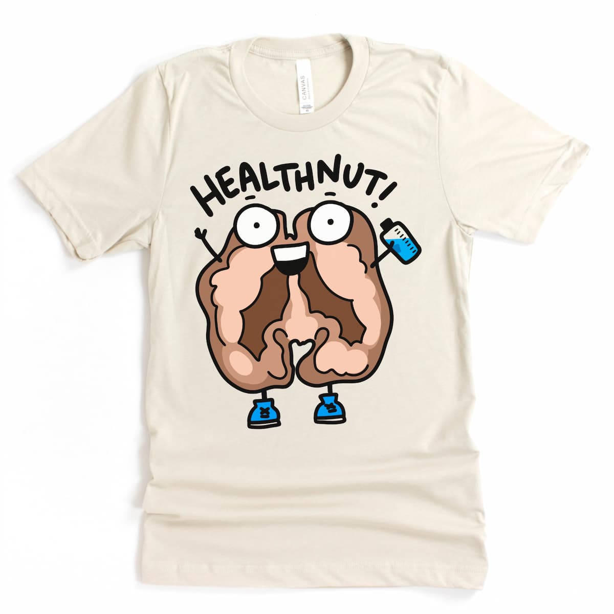 Flat lay of Kalirally Healthnut t-shirt in Heather Dust featuring a cartoon walnut with sneakers and a water bottle exclaiming 'Healthnut!'