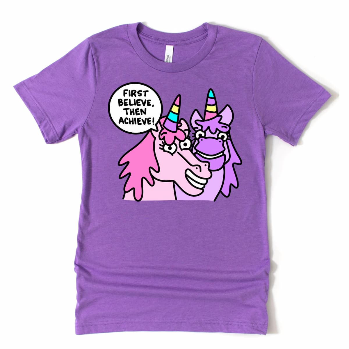 Heather Purple unicorn shirt with motivational “First Believe, Then Achieve.” cartoon unicorn graphic, by Kalirally