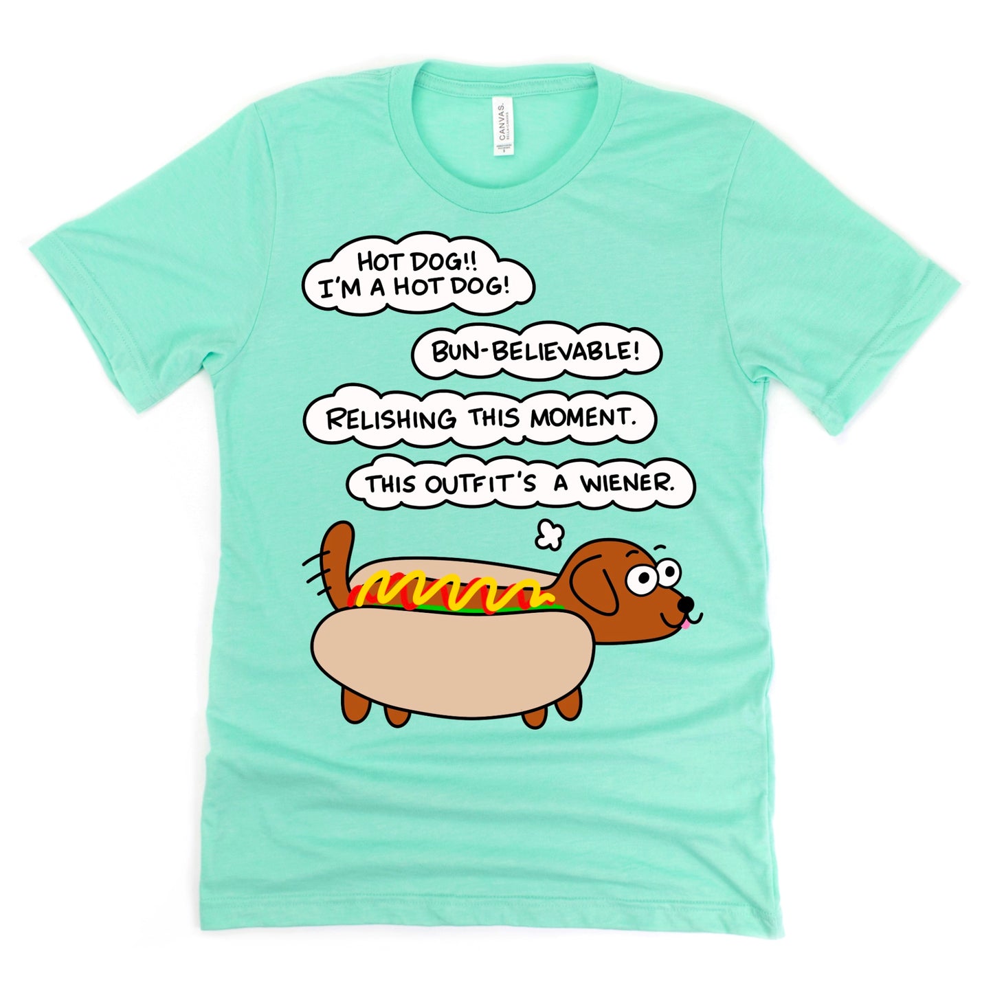 Hot Dog Shirt in Heather Mint Green featuring cartoon dachshund dressed as a hot dog with ketchup and mustard, by Kalirally