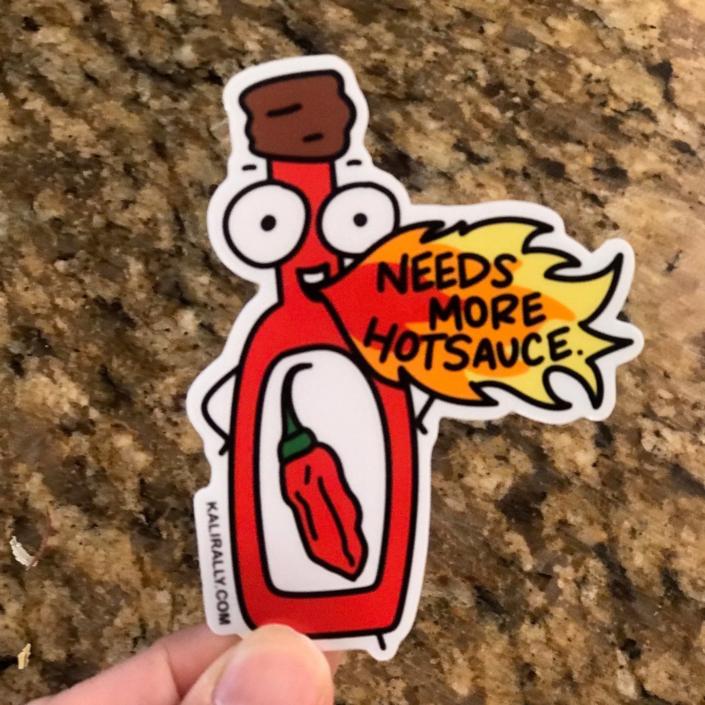 Hot Sauce Sticker with cartoon hot sauce bottle and phrase “Needs more hotsauce!”, funny spicy food decal by Kalirally