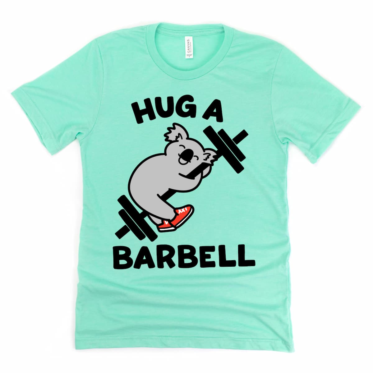 Cute gym shirt for strong women – cartoon koala hugging a barbell on mint green tee, by Kalirally