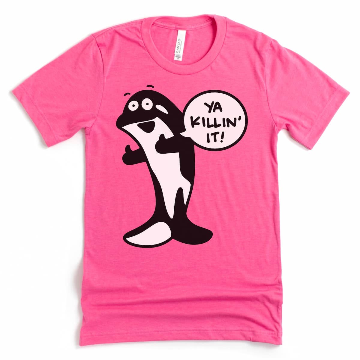 Heather charity pink killer whale t shirt flat lay featuring cartoon orca and “Ya killin it!” text – by Kalirally