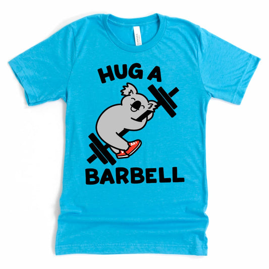 Funny women’s lifting tee with a cartoon koala hugging a barbell – Heather Aqua - by Kalirally