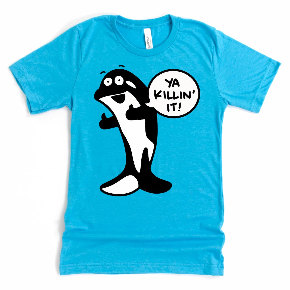 Flat lay of heather aqua orca whale t shirt with smiling killer whale cartoon – by Kalirally