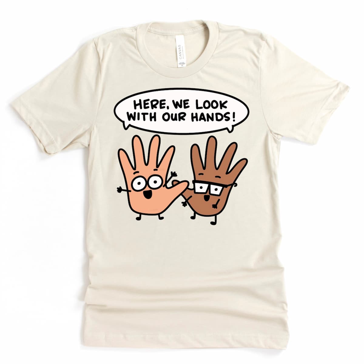 Quirky Parent T Shirt in heather dust with text “Here we look with our hands,” relatable parenting shirt gift by Kalirally