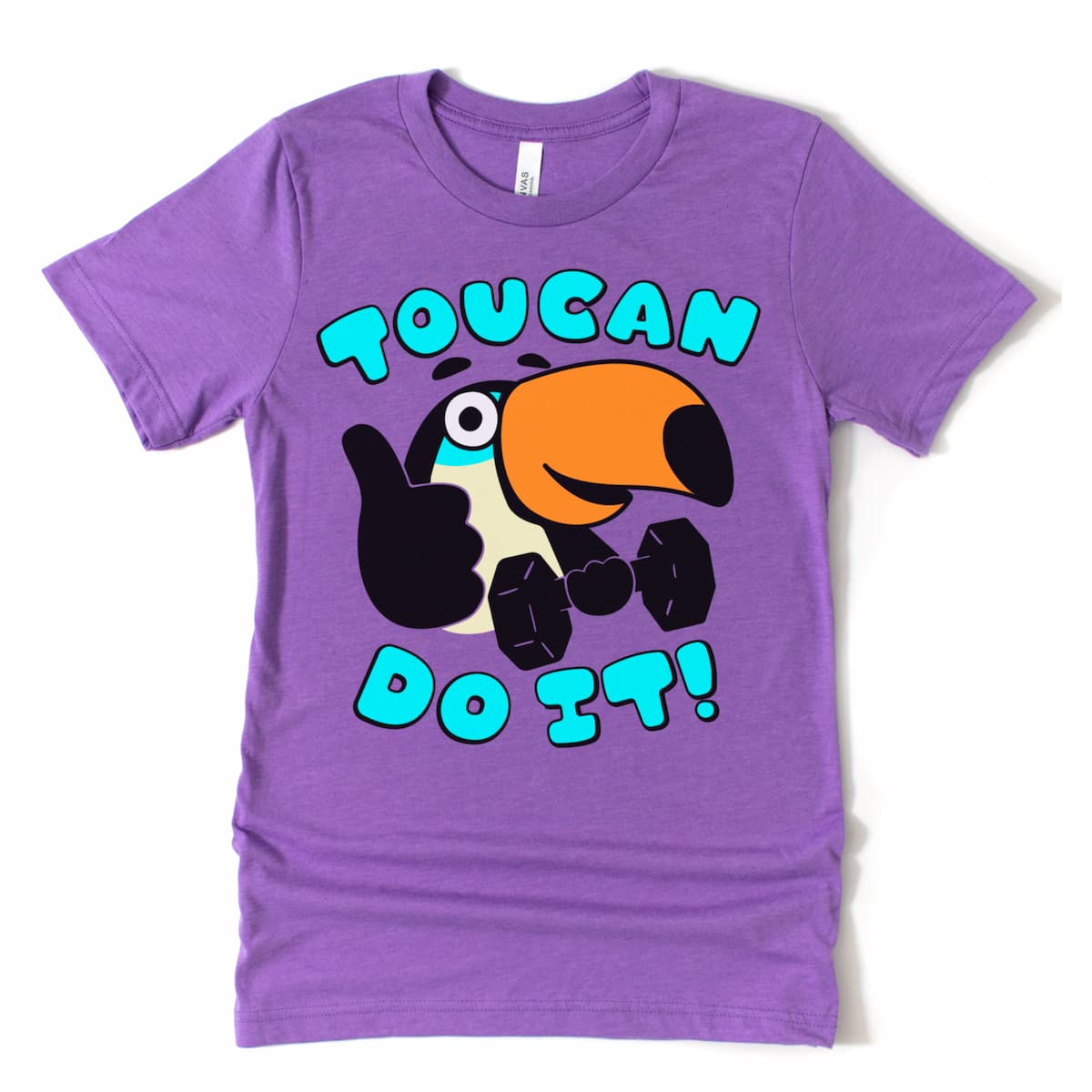 Purple tee with a cartoon toucan reppin' a dumbbell and sending good vibes. Flat lay mockup only.