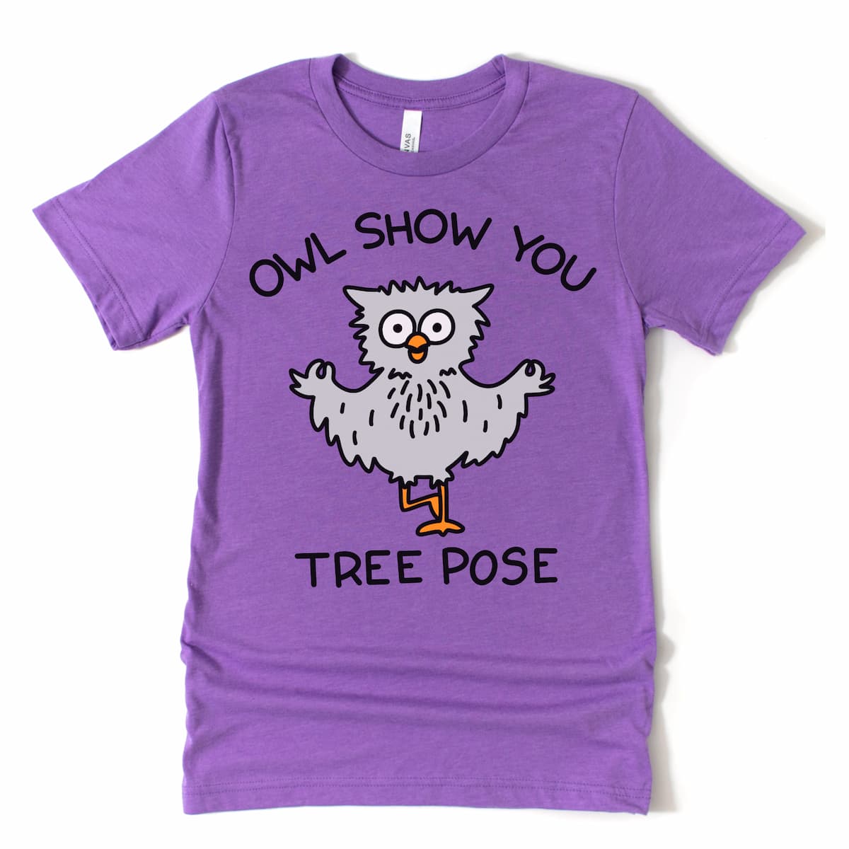 Yoga tshirt with owl in tree pose on purple tee, flat lay style – Kalirally