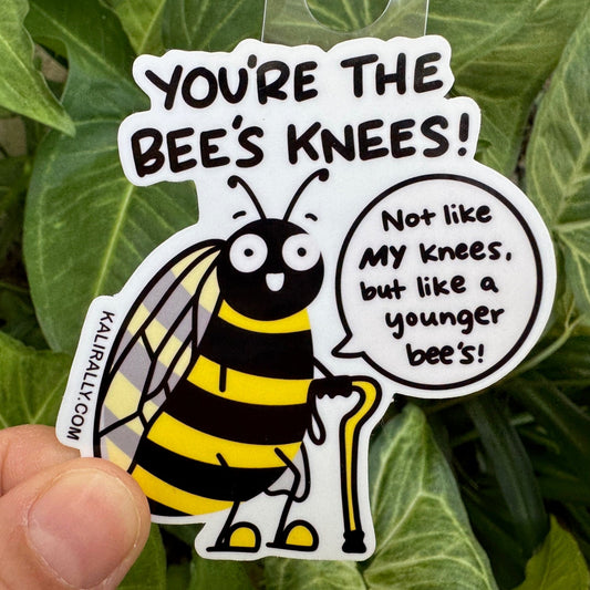 Funny vinyl sticker featuring bees and the phrase "Bad Knees," a twist on the classic "Bees Knees." Humorous pun decal for laptops, bottles, and notebooks by Kalirally.