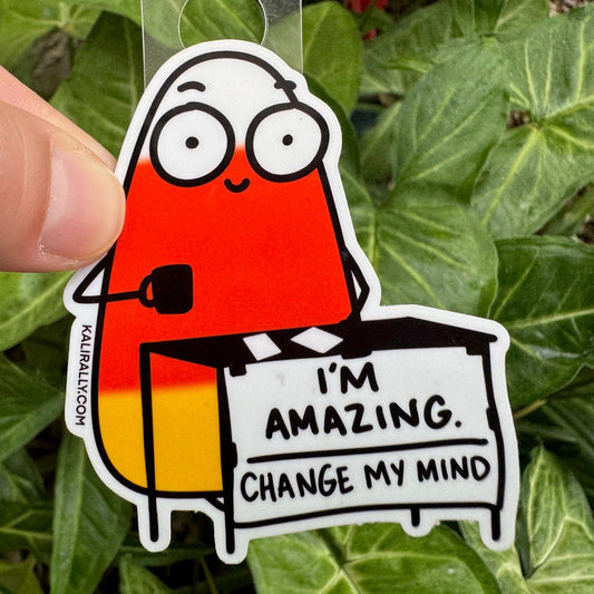 Playful water bottle sticker with cartoon candy corn – “I'm Amazing. Change my mind.” decal for water bottles and laptops by Kalirally