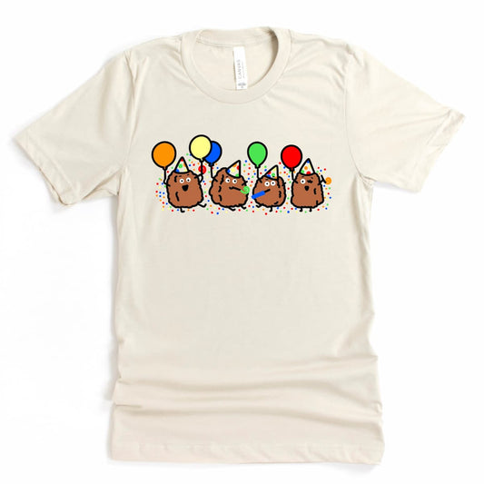 Heather Dust Chicken Nugget Shirt featuring four cartoon nuggets celebrating with balloons and noisemakers, cute funny birthday tee by Kalirally