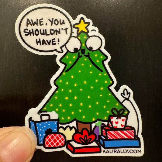 A photo of a 3x3" vinyl glossy Christmas Tree Sticker with cartoon tree saying "Awe, you shouldn't have!" – cute holiday decal, by Kalirally.