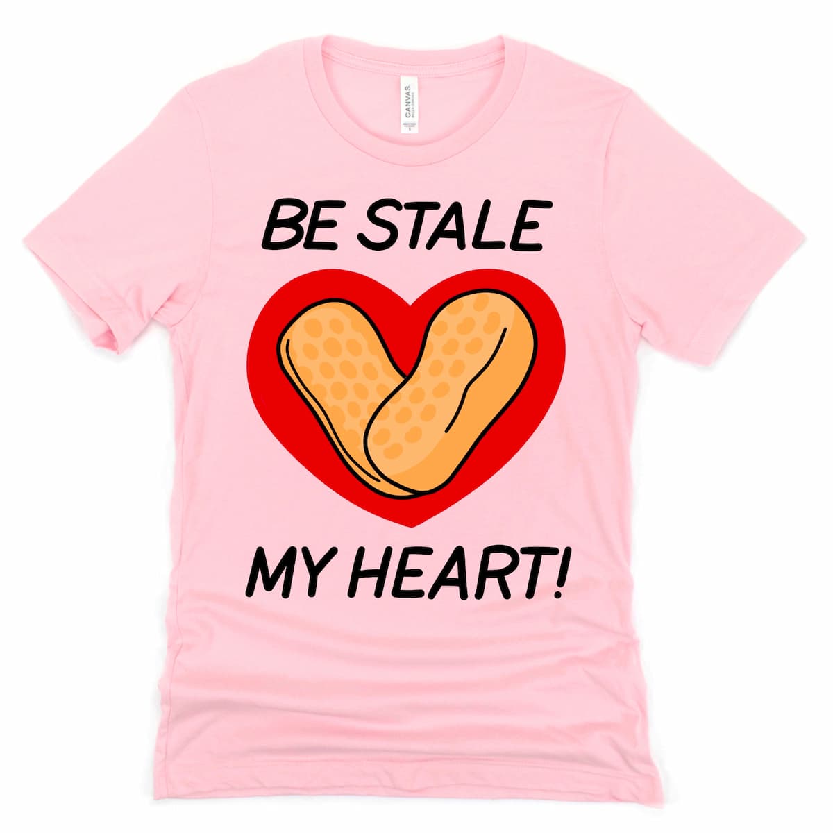 Circus Peanut Shirt in Pink with cartoon stale circus peanut candy and “Be Stale My Heart” phrase, by Kalirally