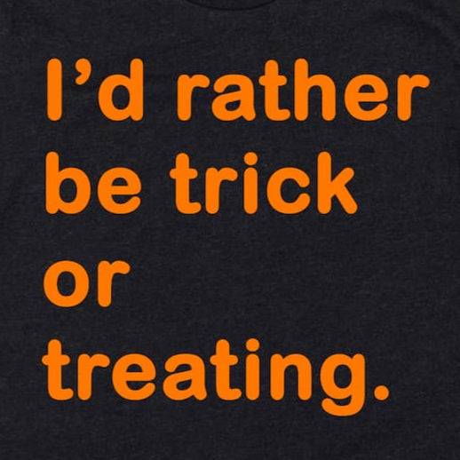 Cropped close-up of I’d Rather Be Trick or Treating Shirt in Heather Black showing playful Halloween phrase and design, by Kalirally