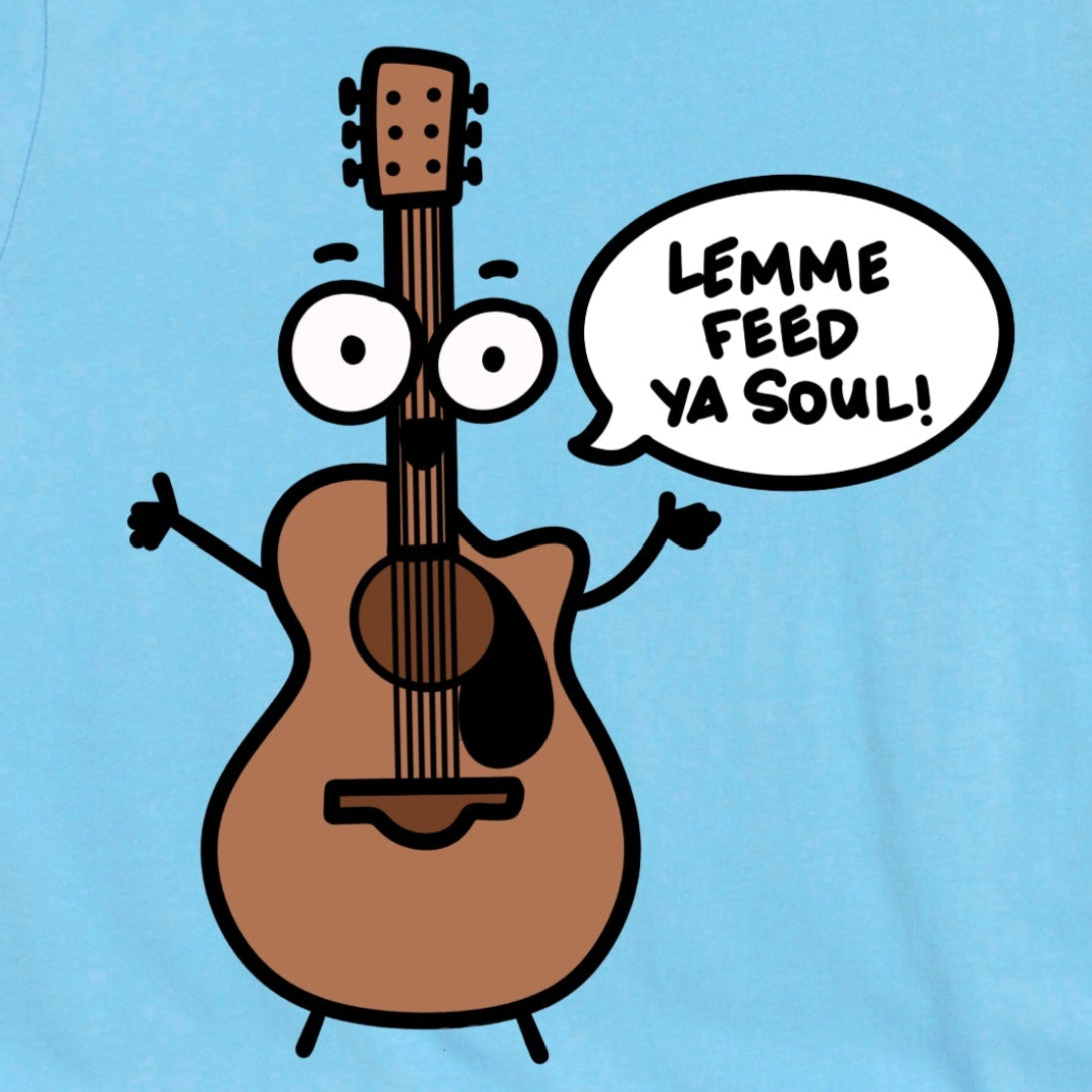 Close-up of Ocean Blue Acoustic Guitar Shirt showing cartoon guitar with “Lemme Feed Ya Soul!” graphic by Kalirally