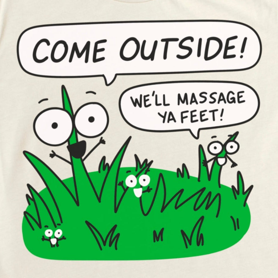 Dark Grey T-Shirt featuring cartoon grass pad with phrase “Come outside, we want to feel ya feet,” funny nature-inspired graphic tee by Kalirally