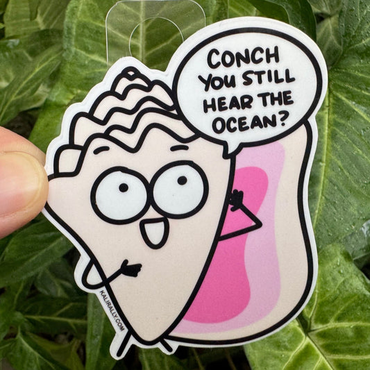 Cartoon Conch Shell character sticker with text 'Conch You Still Hear The Ocean?' held against a leafy background, by Kalirally