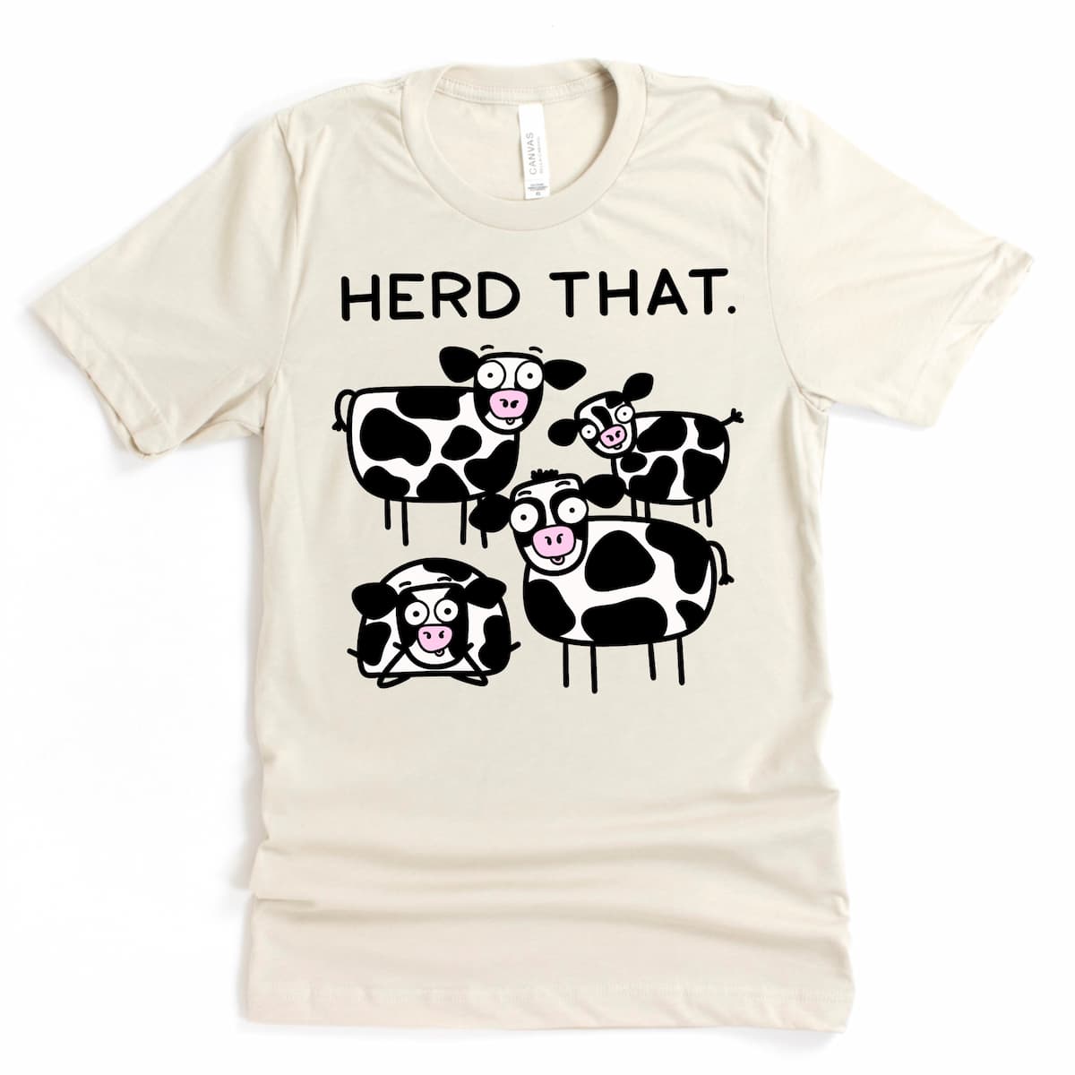 Cow shirt in heather dust with cartoon herd and pun “herd that” – Kalirally