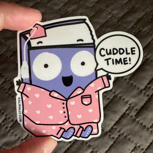 Cuddle Time! sticker showing a smiling book wearing blue pajamas, perfect for bedtime readers