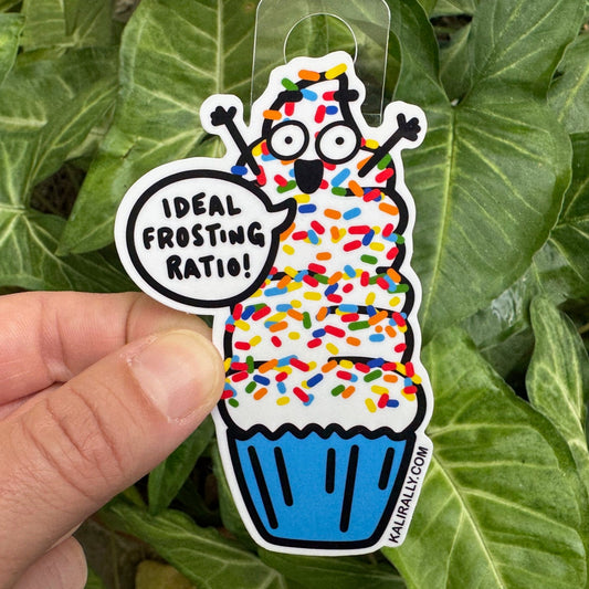Cupcake sticker with cartoon cupcake and swirl of frosting, featuring the phrase "Ideal Frosting Ratio!" Funny dessert vinyl decal for laptops and water bottles.