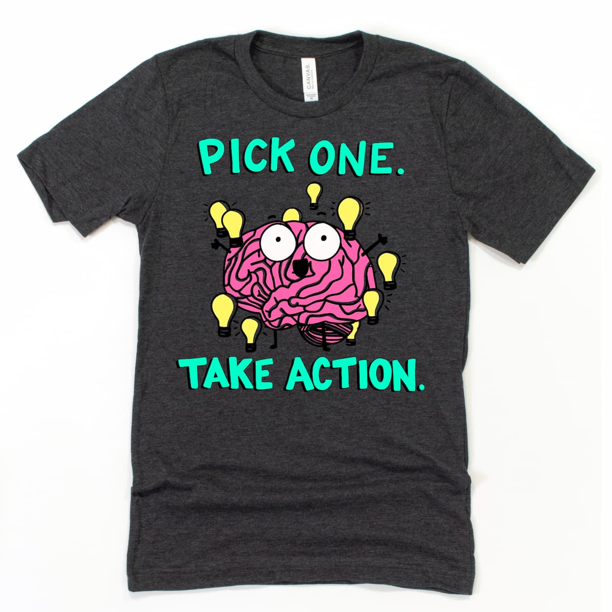 ADHD T Shirt in Heather Dark Grey featuring cartoon brain surrounded by lightbulbs and phrase “Pick one, take action,” by Kalirally
