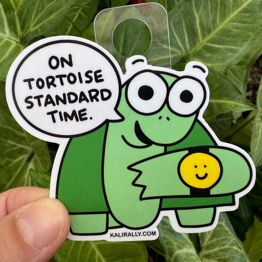 Cartoon tortoise sticker with smiling face and “Enjoy Life” design, fun tortoise decal by Kalirally