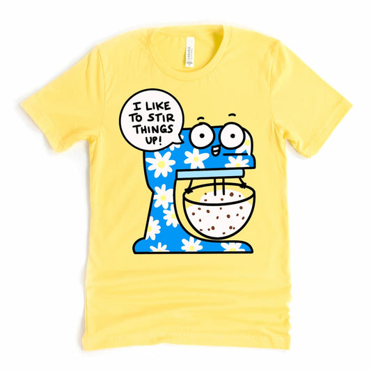 Funny baking shirt with cartoon standing mixer and “I like to stir things up!” phrase in Yellow by Kalirally
