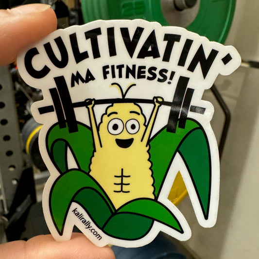 A vinyl glossy waterproof sticker that has a cartoon corn on the cob crushing some overhead presses, and exclaiming, "Cultivatin' ma fitness!"
