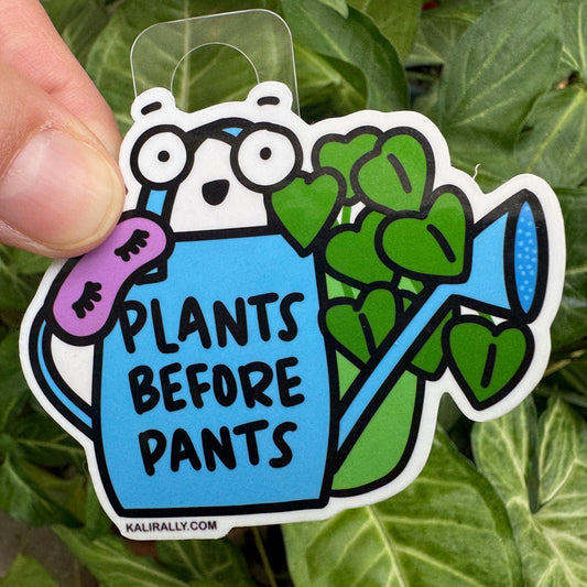 Cartoon-style sticker with the phrase "Plants Before Pants," a funny reminder for plant parents to water their houseplants first thing, by Kalirally.