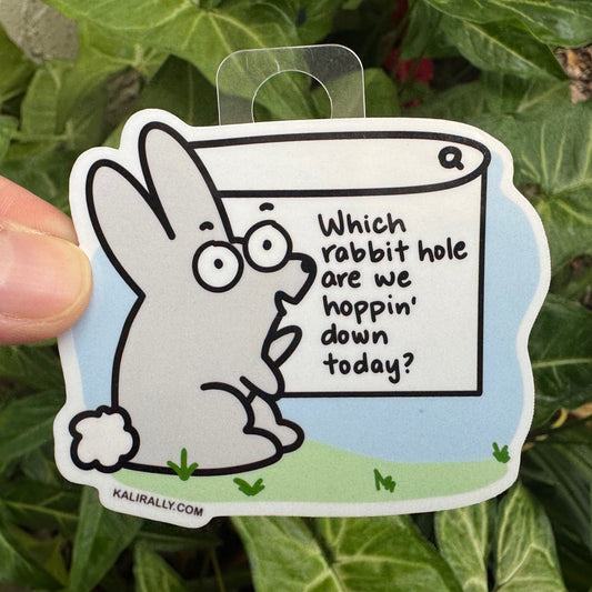 Cartoon bunny sticker with the phrase "Which Rabbit Hole We Hoppin’ Down Today?" Fun vinyl decal for water bottles, laptops, notebooks, and whimsical lovers.