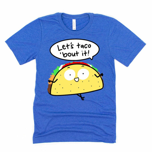 Funny taco pun graphic tee with cartoon taco and “Let’s taco ’bout it!” phrase in Heather True Royal Blue by Kalirally