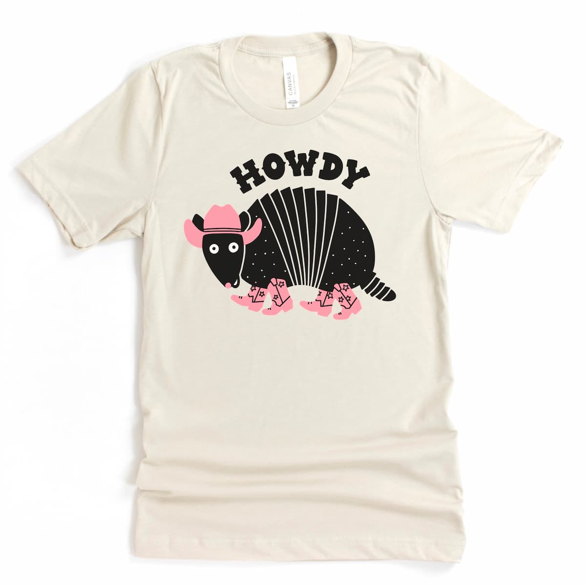 Heather Dust Howdy Armadillo Shirt featuring a cute cartoon armadillo and Texas-style greeting by Kalirally
