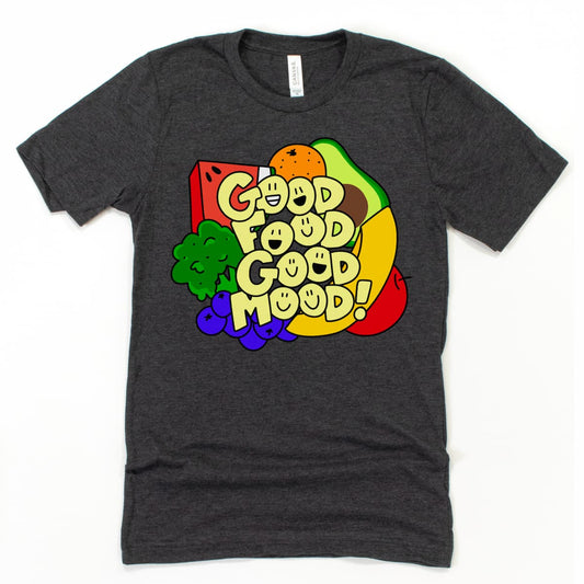Flat lay of an athletic gray Good Food Good Mood T Shirt showing a vibrant lineup of fruits and veggies with playful typography, by Kalirally