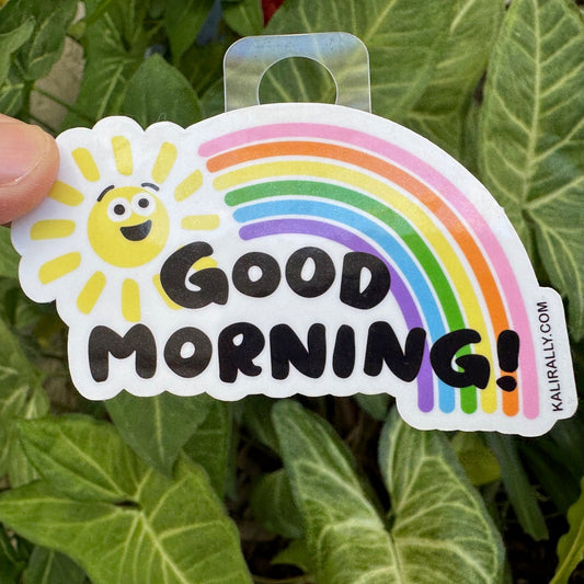 Good Morning Sticker with smiling cartoon sun and rainbow, cheerful positivity decal by Kalirally