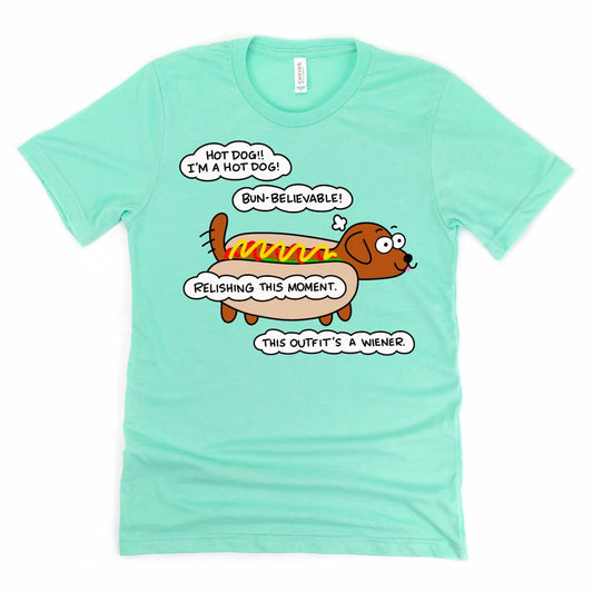 Heather Mint Green Hot Dog Shirt featuring a cartoon dachshund dressed as a hot dog with ketchup and mustard, by Kalirally