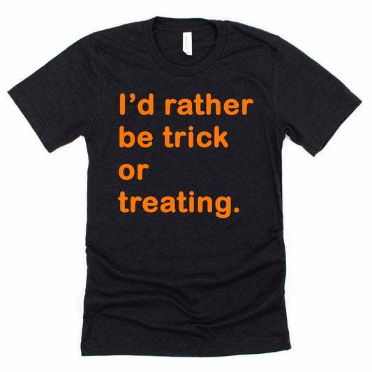 I’d Rather Be Trick or Treating Shirt in Heather Black with playful Halloween design and “I’d Rather Be Trick or Treating” phrase, by Kalirally