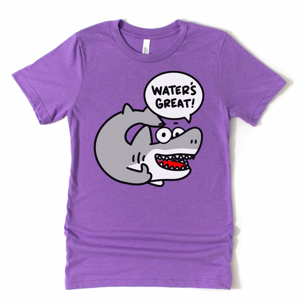 Team purple shark t-shirt by Kalirally with a cheerful cartoon shark and “Water’s great!” slogan – laid-back beachwear flat lay.
