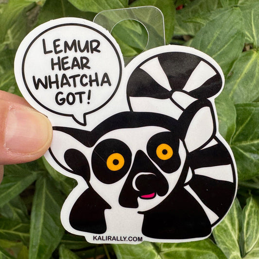 Cartoon lemur sticker with big eyes and the phrase "Lemur Hear Whatcha Got." Funny vinyl decal for speech teachers, therapists, and animal pun lovers.