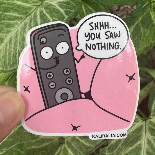 Cartoon TV remote sticker hiding in couch with the phrase “Shhh… You saw nothing,” funny waterproof decal by Kalirally.