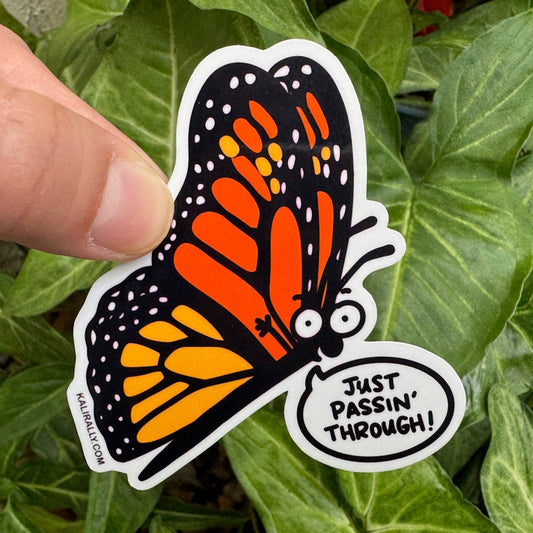 Cartoon monarch butterfly sticker with the phrase "Just Passin’ Through!" Fun vinyl decal for water bottles, laptops, notebooks, and butterfly or science lovers, by Kalirally.