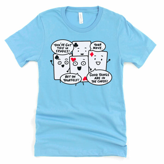 Close-up of four cartoon playing cards with punny messages on ocean blue shirt Kalirally