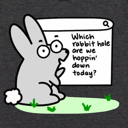 A Close up of the Rabbit hole graphic curiosity tee design in Heather Dark Grey by Kalirally.