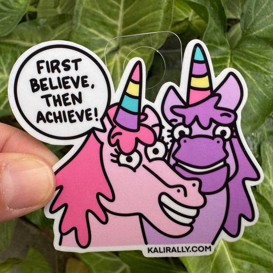 Motivational unicorn sticker with the phrase “First believe, then achieve!” inspiring self-belief and achievement